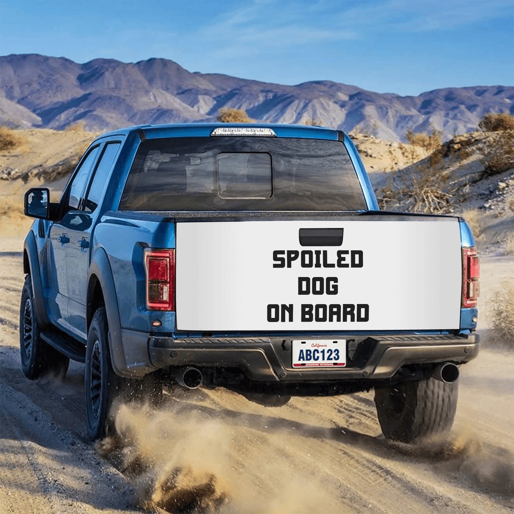 Car sticker featuring 'Spoiled Dog on Board' text, designed in playful font with a paw print graphic